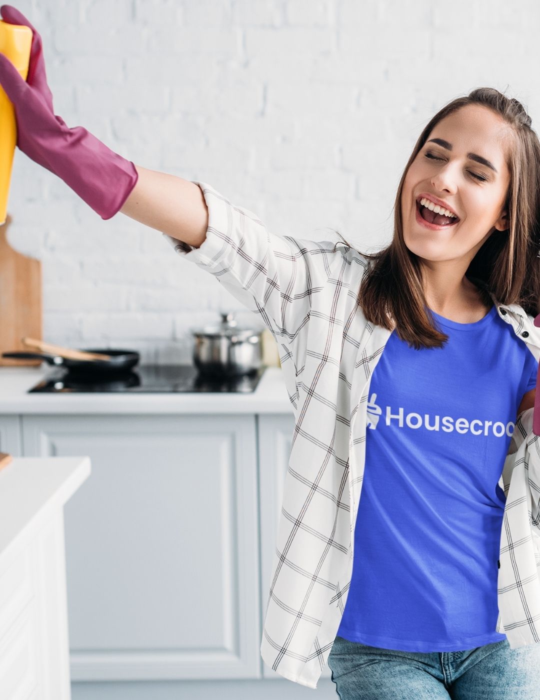 Happy Housecroo cleaning professional at work